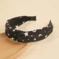 Black knotted hair hoop with white star and moon print, stylish celestial chic fashion headband. - Star & Moon Print / Star