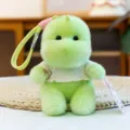 Leuke pluche dinosaurus pop sleutelhanger met pyjama, zacht knuffeldier voor bestuur decoratie. - Dinosaurus