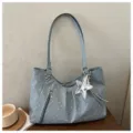 Korean style polka dot shoulder bag with large capacity, front zipper pocket and cute star pendant. - Blue