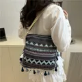 Ethnic style woven shoulder bag with chic tassels and retro geometric pattern for daily fashion. - Blue
