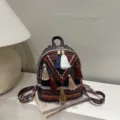Bohemian mini backpack with woven ethnic pattern and colorful tassels, stylish casual daily use. - Red