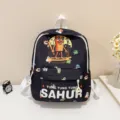 Detailed view of the cute black kids cartoon backpack with graphic print and front pocket. - Black