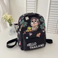 Detail view of the cute cartoon printed kids backpack, waterproof fabric, lightweight design. - Black