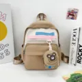 Cute cartoon canvas backpack for kids, beige and white color block design with bear pendant. - Khaki