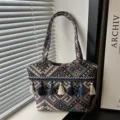 Vintage ethnic woven shoulder bag with chic tassels and spacious tote design for women. - Style 3