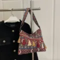 Boho ethnic woven shoulder bag with colorful geometric patterns and stylish tassels. - Red