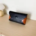 Minimalist contrast color clutch bag for women, elegant evening party handbag with button. - Black