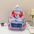 Detailed view of a vibrant purple children backpack with funny cartoon print and front pocket. - Purple