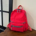 Casual red backpack with turquoise zippers, large capacity school bag for students daily use. - Red