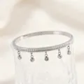 Titanium steel bracelet with single row crystals and hanging charms, elegant Korean style detail. - Steel-Tone Gypsophila Dangle Rhinestone Bangles