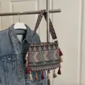 Bohemian ethnic woven shoulder bag with colorful tassels and geometric wide strap style for women - Green
