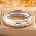 Wide polished metallic bangle bracelet, modern smooth silver cuff for daily fashion jewelry. - Steel Spring Polished Bangle (SZ764)