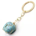 Detail view of wire wrapped turquoise stone keychain with gold ring, fashion bag accessory. - 3-Section Chain / Turquoise
