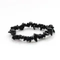 Close-up detail of natural black crystal chip bracelet, irregular polished stone beads. - Obsidian