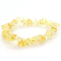 Detailed close-up of natural yellow crystal chip bracelet, showing irregular polished stones. - Citrine
