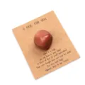 Close-up detail of pocket hug crystal stone on a greeting card, heartfelt gift for loved ones. - Gold Sandstone