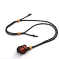 Adjustable black woven rope necklace with natural goldstone crystal and wooden beads detail. - Gold Sandstone