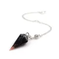 Detail close-up of a crystal dowsing pendulum with a black resin hexagonal cone and copper spiral. - Pendulum Pendant With Chain / Black Agate