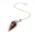 Close-up detail of the crystal resin cone pendant with metal chain for divination use. - Pendulum Pendant With Chain / Tiger's Eye