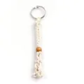 Detail shot of handmade macrame woven lanyard with metal ring and wooden bead decoration. - Keychain / Net bag size 3-5CM / Off White