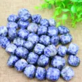 Detailed view of natural blue tumbled stones for crystal healing, yoga, and home decor. - Blue Vein Stone