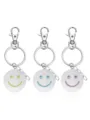 Élégante variante de porte-clés visage smiley en métal, accessoire cadeau parfait. - Bleu et bleu-vert lumineux / Vert-Visage Souriant