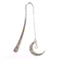 Vintage metal bookmark with moon and star pendant detail, celestial aesthetic reading accessory. - Antique Style