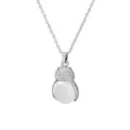 Close-up detail of silver owl pendant necklace with round white gemstone, delicate metal carving. - White Crystal