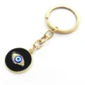Porte-clés œil turc doré avec pendentif rond noir, accessoire élégant en alliage métallique. - Porte-clés œil