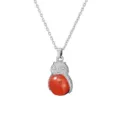 Detailed view of silver owl necklace pendant featuring a vibrant red gemstone belly design. - Watermelon red