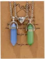 Close up of hexagonal crystal couple magnetic matching necklace set on kraft paper card detail view. - Luminous Green & Luminous Blue