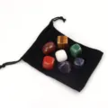 Detailed view of 7 pieces natural crystal tumbled stones set with black velvet storage pouch. - 7 Chakra Tumbled Stones + Velvet Pouch