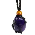 Close-up detail of a raw amethyst crystal gemstone secured in a black woven mesh cord necklace. - Irregular Natural Stone / Stones Approx 2-3cm / Amethyst with Black Mesh Pouch