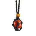 Detailed close-up view of the raw red stone pendant wrapped in a black woven net cord. - Irregular Natural Stone / Stones Approx 2-3cm / Red Jasper with Black Mesh Pouch