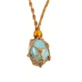 Detailed close-up of the light blue crystal stone inside the handmade woven rope net pendant. - Irregular Natural Stone / Stones Approx 2-3cm / Green Aventurine with Brown Mesh Pouch