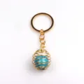 Goldener Metallschlüsselanhänger mit Spiralanhänger und blauem Schmuckstein Perle 16mm - Türkis