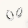Silver irregular chunky hoop earrings close-up view minimalist fashion jewelry design - Silver