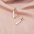 Elegant gold safety pin stud earrings adorned with delicate white faux pearls for women. - White Artificial Pearl Pin Style (SE1011)
