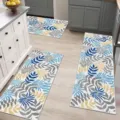 Detailed view of kitchen floor mats with blue and yellow botanical leaf pattern in modern kitchen. - HY Kitchen 3-Piece Set - 8
