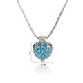 Close-up of the hollow heart-shaped aromatherapy locket pendant necklace with fine metal details. - Hollow Heart Style (NX273)