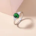 Stunning silver-tone cluster ring featuring an elegant oval green gemstone and sparkling clear stones. - Size 7 / Oval Green Style (SE1166) / Silver