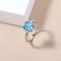 Silver plated women ring featuring light blue square zircon and side micro pave white stones. - Size 7 / Rectangle Blue Style (SE1164) / Silver