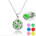 Detailed view of hollow locket necklace with open charm and multiple colored pom pom balls. - Hollow Ball Style (NX108)