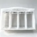 Set of 4 clear heat-resistant glass storage jars with airtight lids in foam packaging. - 4 Pieces/Pack / 4 Pieces EPE Foam