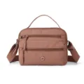 Nylon crossbody bag for women, casual multi-pocket shoulder bag with top handle and strap. - Pink