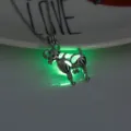 Glow in the dark sheep pendant necklace detail view, luminous animal charm necklace close up shot. - Sheep-Yellow Green Glow