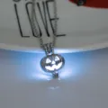 Halloween glowing pumpkin pendant necklace, creative hollow metal fashion jewelry gift. - Pumpkin-Sky Blue Glow