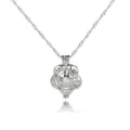 Close-up detail of silver-toned hollow flower cage locket pendant necklace with inner pearl. - Rose (NY133)