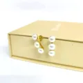 Elegant stainless steel triple pearl gold earrings, modern luxury minimalist design jewelry. - Multi-Pearl Curved Row Style
