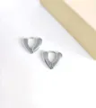 Silver stainless steel heart huggie hoop earrings, minimalist geometric jewelry style. - Heart Huggie Earrings / Steel